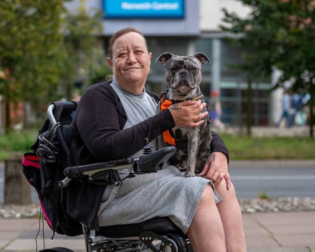 Karen Bishop, 51, with her 2-year-old French bull dog Drew outside the Travelodge in Norwich.