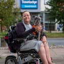Karen Bishop, 51, with her 2-year-old French bull dog Drew outside the Travelodge in Norwich.