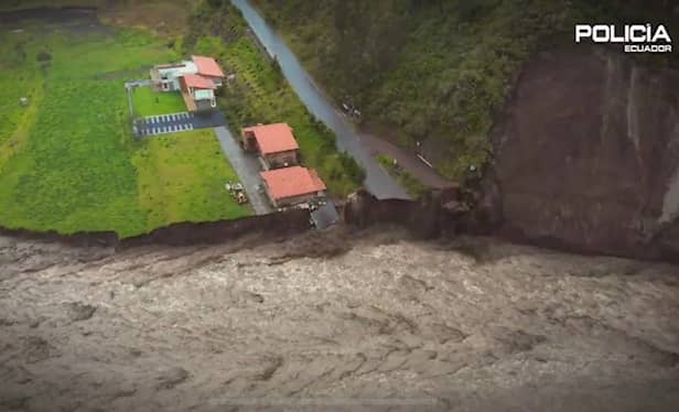Waves of mud crash through tourist city as landslide kills 6.