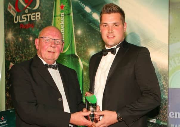Bobby Stewart, President IRFU Ulster Branch, on behalf of City of Derry R.F.C.,  presents the Ken Goodall Outstanding Club Player of the Year Award to Rodger McBurney from Ballymena