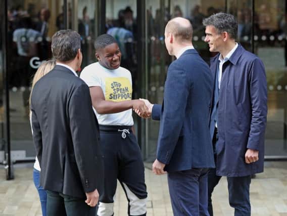 The Duke of Cambridge is greeted by James Okulaja from the young people's anti-bullying panel, as he arrives for the final meeting of The Royal Foundation's Taskforce on the Prevention of Cyberbullying, at Google in King's Cross, London